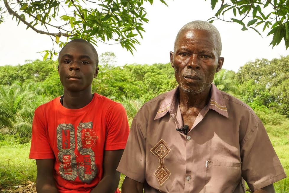 Samuel Nyah with his son Benedict, 16, a student at the Bridge-run Cinta Public School